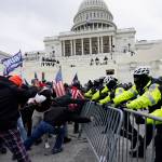 Trump supporters try to break through a police barrier, Wednesday, Jan. 6, 2021, at the Capitol in Washington. As Congress prepares to affirm President-elect Joe Bidens victory, thousands of people have gathered to show their support for President Donald Trump and his claims of election fraud. (AP Photo / Julio Cortez)