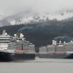 The Holland America Line cruise ships Eurodam, left, and Nieuw Amsterdam pull into Juneau’s downtown harbor on May 1, 2017. Holland America extended its pause on sailings to Alaska until mid-May as the company tries to find ways to sail under new health regulations. (Michael Penn | Juneau Empire File)