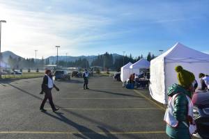 Health workers during a mass vaccination event for influzena at Thunder Mountain High School on Saturday, Oct. 24, 2020. The flu vaccine event served as a practice run for COVID-19 vaccine distribution, according to health officials. Such distribution requires coordination between multiple state and local agencies. (Peter Segall / Juneau Empire file)