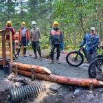 Trail Mix volunteers Tom Bornstein, Eric Olsen, Tom Krehbiel, Dave Haas, Joe Sorenson, Bill Janes and Chris Meade complete an approach ramp on the Treadwell Ditch Trail. (Courtesy photo / Ryan OShaughnessy)