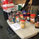 Volunteers and members of the Black Awareness Association of Juneau to help hold a food and childcare needs drive at several locations, including the Foodland IGA seen above, for Martin Luther King Jr. Day, Jan. 18, 2021. (Michael S. Lockett / Juneau Empire)