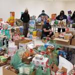 Members of the Black Awareness Association of Juneau and other volunteers collect donations from Juneau residents from their Martin Luther King Jr. Day donation drive on Jan. 18, 2021. (Courtesy photo / Black Awareness Association of Juneau)