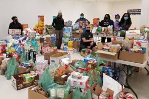 Members of the Black Awareness Association of Juneau and other volunteers collect donations from Juneau residents from their Martin Luther King Jr. Day donation drive on Jan. 18, 2021. (Courtesy photo / Black Awareness Association of Juneau)
