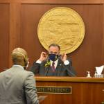 Newly elected Senate President Peter Micciche, R-Soldotna, speaks to Sen. David Wilson, R-Wasilla, on the first day of the 32nd Legislature on Tuesday, Jan. 19, 2020. (Peter Segall / Juneau Empire)