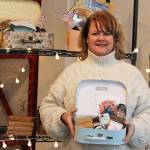 Ben Hohenstatt / Juneau Empire 
Midgi Moore, CEO of Juneau Food Tours, holds up a Taste Alaska! Alaska Sweetheart Box inside Juneau Food Tours new location on Shattuck Way. The boxes, which were launched in June, are a way for Juneau Food Tours to give people a taste of the capital city amid the pandemic.