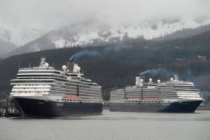 The Holland America Line cruise ships Eurodam, left, and Nieuw Amsterdam pull into Juneaus downtown harbor on May 1, 2017. (Michael Penn / Juneau Empire File)