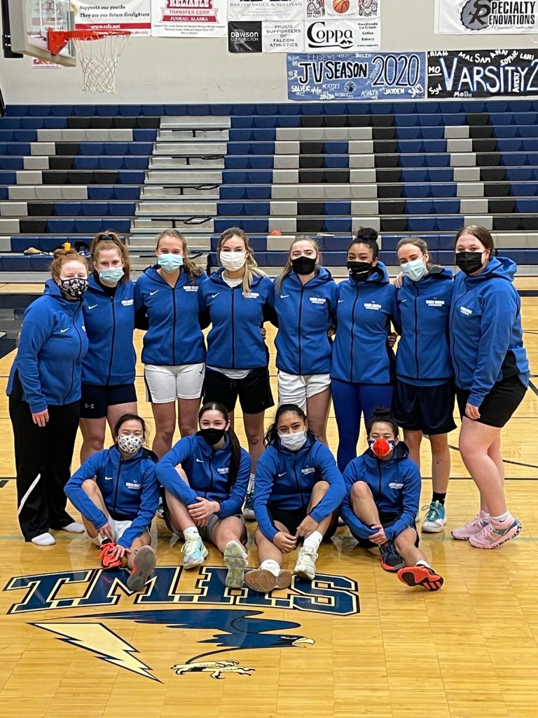 The Thunder Mountain High School girls varsity basketball team gathers for a group photo. (Courtesy photo / Andy Lee)
