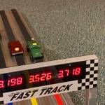 Cars zoom down the track at Saturday's Pinewood Derby. The COVID-19 pandemic forced the race to move a virtual format. (Dana Zigmund/Juneau Empire)