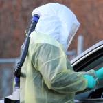 Sarah Palmer holds up a swab before administering a COVID-19 test in late December. The state announced on Tuesday that a variant of the virus that causes COVID-19 had been detected in Alaska for the first time. (Ben Hohenstatt / Juneau Empire)