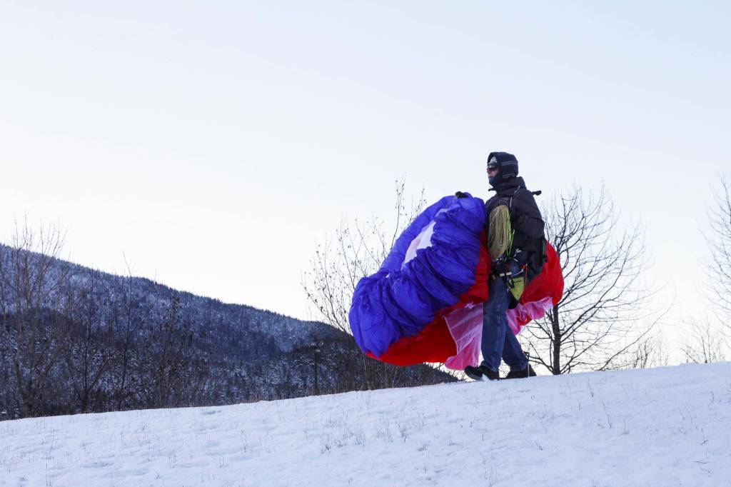 Robert Fawcett familiarizes himself with a new wing alongside the Gastineau Channel at Wayside Park on Jan. 27, 2021. (Michael S. Lockett / Juneau Empire)