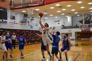 Juneau-Douglas High School Yadaa.at Kalé player Tias Carney shoots during a game against Thunder Mountain High School on Jan. 30, 2021. (Courtesy photo / Lexie Razor)