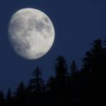 A nearly full moon can be seen rising over Thunder Mountain. A recent spate of clear skies has meant blue skies during the day and a bright moon and visible stars at night. (Ben Hohenstatt / Juneau Empire File)