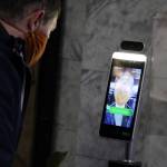 Ben Hohenstatt / Juneau Empire
State Sen. Jesse Kiehl, D-Juneau, has his temperature taken inside the Alaska State Capitol on Jan. 19. The high tech check-ins have become routine over the past few weeks.