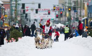 In this March 2018 photo,  Aliy Zirkle runs her team during the ceremonial start of the Iditarod Trail Sled Dog Race in Anchorage, Alaska. There has been another dramatic change to the world’s most famous sled dog race this year because of the pandemic, with officials announcing Friday, Feb. 5, 2021, that the ceremonial start has been canceled. (AP Photo / Michael Dinneen)