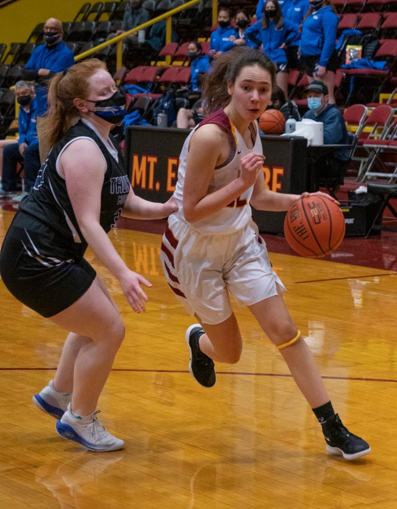 Thunder Mountain High School player Mackenzie Gray, left, competes against Mt. Edgecumbe High School in Sitka on Saturday, Feb. 6, 2021. (Sitka Sentinel / James Poulson)