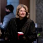 Sen. Lisa Murkowski, R-Alaska, arrives at the start of the fifth day of the second impeachment trial of former President Trump, Saturday, Feb. 13, 2021 at the Capitol in Washington. (Stefani Reynolds / Pool via AP)