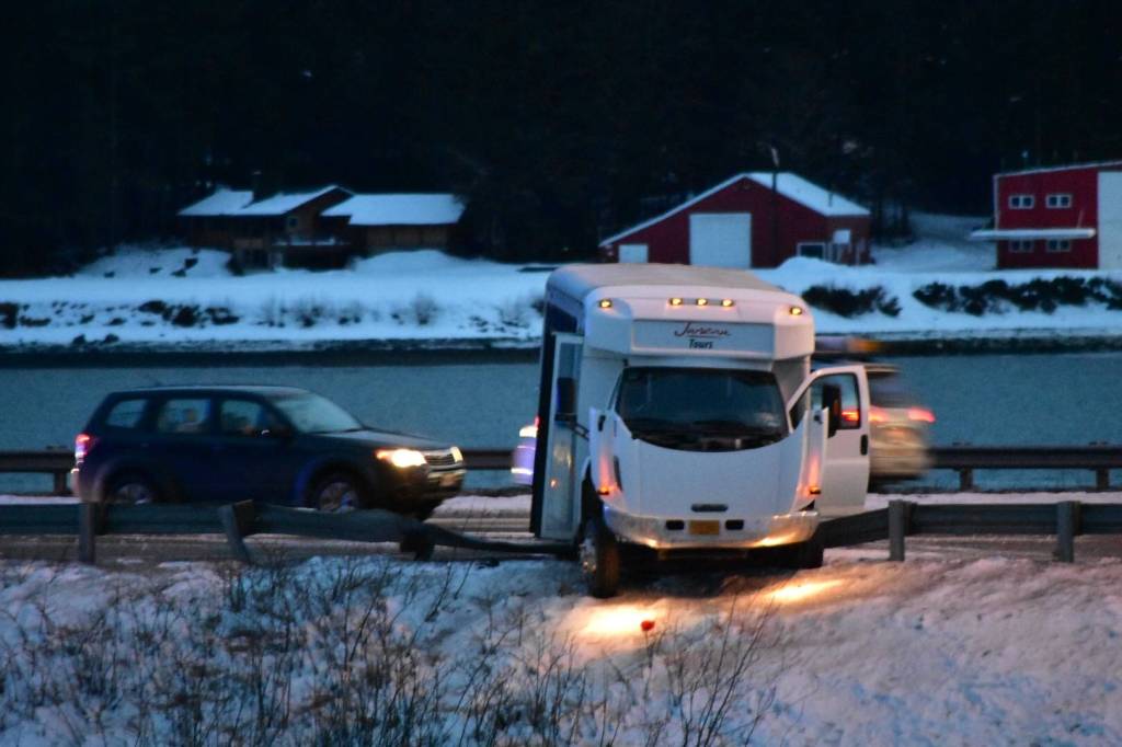 A Juneau Tours minibus crashed into a guardrail on Egan Drive near Twin Lakes for reasons unknown on Feb. 15, 2021. (Peter Segall / Juneau Empire)