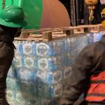 Coast Guard Cutter Hickory crewmembers offload pallets of water destined for the residents in Angoon, Alaska, Feb. 14, 2021. (U.S. Coast Guard photo)