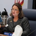Alaska state Sen. Lora Reinbold, an Eagle River Republican, holds a copy of the Alaska Constitution during a committee hearing on Wednesday, Jan. 27, 2021, in Juneau, Alaska. Gov. Mike Dunleavy, a Republican, sent Reinbold a letter on Feb. 18, 2021, saying she has used her position to misrepresent the states COVID-19 response. Reinbold said the letter was full of baseless accusations and complaints. (AP Photo / Becky Bohrer)