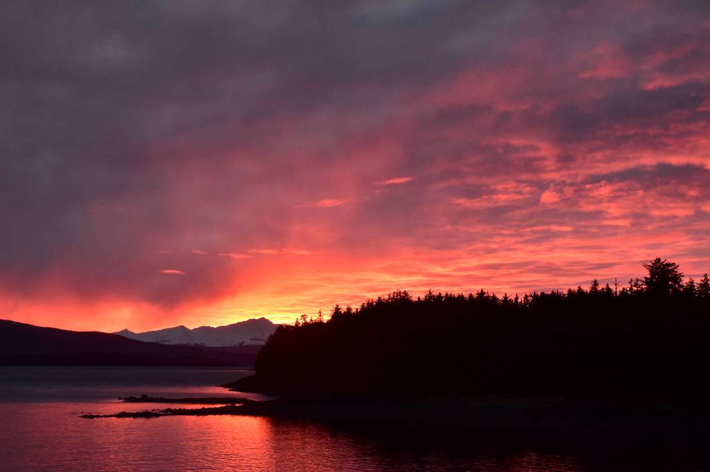 The setting sun lights up the sky in Smugglers Cove on March 7. (Courtesy Photo / Kate Schwarting)