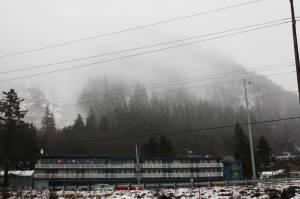 The Behrends Avenue avalanche chute is visible above the Breakwater Inn on Feb. 27, 2021, when extreme avalanche risk prompted evacuation of the area. (Michael S. Lockett / Juneau Empire)