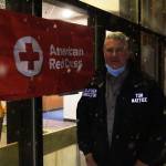 City and Borough of Juneau emergency program manager Tom Mattice stands outside Centennial Hall, appropriated as an evacuation shelter for those in the path of possible avalanches on Feb. 27, 2021. (Michael S. Lockett / Juneau Empire)
