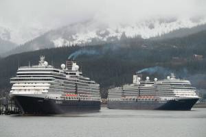 The Holland America Line cruise ships Eurodam, left, and Nieuw Amsterdam pull into Juneaus downtown harbor on May 1, 2017. Large cruise ships are unlikely to visit Alaska this summer due to ongoing COVID-19 concerns, restrictions at the Canadian border, and a lack of sailing guidance from the Centers for Disease Control. However, in a close 5-4 vote Monday evening, the City Assembly decided to relax COVID-19-related travel mandates sooner rather than later and made other changes to make travel easier for the upcoming tourist season. (Michael Penn/Juneau Empire File)