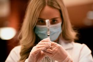 Pharmacist Madeline Acquilano draws a syringe of Johnson & Johnson COVID-19 at Hartford Hospital in Hartford, Conn., Wednesday, March 3, 2021. The first shipments of the vaccine arrived at the hospital this morning. Cities and states are rapidly expanding access to vaccines as the nation races to head off a resurgence in coronavirus infections and reopen schools and businesses battered by the pandemic. (AP Photo/Jessica Hill)