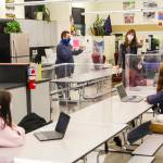 Juneau School District Superintendent Bridget Weiss, center-right, talks to students as they re-enter Floyd Dryden Middle School on Jan. 11, 2021, the first day of hybrid learning after nine months of distance learning due to COVID-19. The extended break from full-time, in-person learning has meant enrollment changes for the district, which has resulted in reduced grant money. On Wednesday night, the city Finance Committee unanimously agreed to transfer $56,646 to the Juneau School District to help shore up fiscal year 2021 coffers. (Michael S. Lockett / Juneau Empire)
