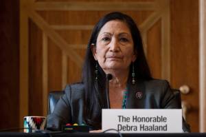Rep. Deb Haaland, D-N.M., listens during the Senate Committee on Energy and Natural Resources hearing on her nomination to be Interior secretary, on Capitol Hill in Washington. Some Republican senators labeled Haaland radical over her calls to reduce dependence on fossil fuels and address climate change, and said that could hurt rural America and major oil and gas-producing states. The label of Haaland as a radical by Republican lawmakers is getting pushback from Native Americans. (Jim Watson / Pool Photo)