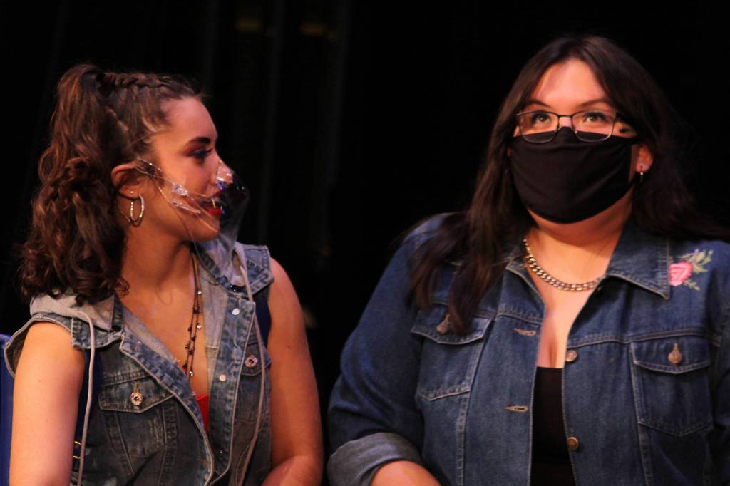Clara Smith talks to Jaylynn Martin in a scene during rehearsal for Fame: The Musical. Masks are part of the mitigation measures the production adopted in light of the pandemic. Additionally, the show, which opens Friday evening, will be livestreamed instead of performed in front of a full auditorium. (Ben Hohenstatt / Juneau Empire)