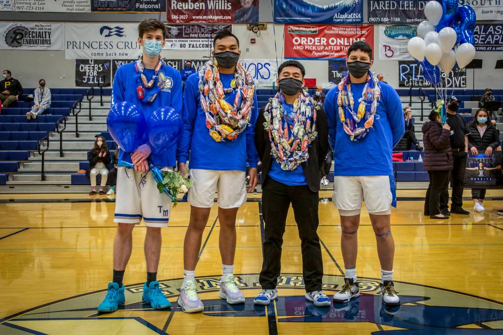 TMHS seniors Trenton English, Meki Toutaiolepo, Koneal Laguidao and Oliver Mendoza stand together at mid-court. (Courtesy Photo / Heather Holt)