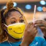 Medical Assistant Keona Shepard holds up the Johnson & Johnson COVID-19 vaccine as she prepares to administer it at the New Orleans Ernest N. Morial Convention Center during the mass coronavirus vaccination in New Orleans, in this Thursday, March 4, 2021, file photo. (Chris Granger / The Advocate)