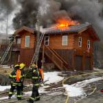 Capital City Fire/Rescue firefighters seek to extinguish a house fire near Point Lena on March 10, 2021. (Courtesy photo / CCFR)