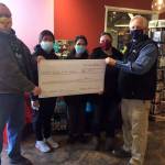 Pictured are ( left to right) Shane Walker, deputy director, Juneau Animal Rescue; Christina Austin, Foodland casher; Cecilia Watson, Foodland cashier; Kelly Crow, Super Bear store director; and Rick Wilson, Foodland store director (Courtesy Photo)