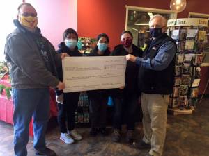 Pictured are ( left to right) Shane Walker, deputy director, Juneau Animal Rescue; Christina Austin, Foodland casher; Cecilia Watson, Foodland cashier; Kelly Crow, Super Bear store director; and Rick Wilson, Foodland store director (Courtesy Photo)