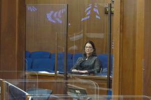 Alaska state Sen. Lora Reinbold sits in a Senate gallery on Friday, March 12, 2021, in Juneau, Alaska. The Alaska Senate voted Wednesday to allow leadership to restrict access to the Capitol by Reinbold, an Eagle River Republican, over violations of protocols meant to guard against COVID-19. (AP Photo / Becky Bohrer, Pool)