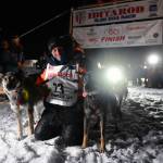 Dallas Seavey poses with his dogs after crossing the finish line to win the Iditarod Trail Sled Dog Race race near Willow, Alaska, early Monday, March 15, 2021. (Marc Lester/Anchorage Daily News, Pool)