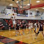 Juneau-Douglas High School Yadaa.at Kalé senior Cooper Kriegmont shoots during a basketball game against Ketchikan on Friday, Jan. 22, 2021. Kriegmont and the JDHS boys will face Ketchikan for the title on March 20, 2021. (Courtesy photo / Lexie Razor)
