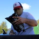 AmeriCorps volunteer Aidan Chadwick places a three-day supply of emergency rations into a container, which will be shipped by Central Council of Tlingit and Haida Indian Tribes of Alaska Tribal Emergency Operations Center to Southeast communities. (Ben Hohenstatt / Juneau Empire File)