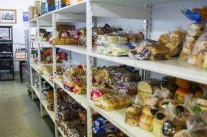 The shelves at the Southeast Alaska Food Bank were full on Feb. 18, 2021, as food banks around the state have been working hard to meet extra demand caused by the coronavirus pandemic, but starting in April its possible the state could lose $8 million a month in federal food stamp benefits. (Michael S. Lockett / Juneau Empire)