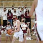 Juneau-Douglas High School Yadaa.at Kalé player Tias Carney looks to pass to Lope Elizarde during the first half in the boys varsity Region V basketball championship against Ketchikan High School at Clarke Cochrane Gymnasium on Saturday, March 20, 2021. (Dustin Safranek / Ketchikan Daily News)