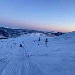 The author and Fairbanks resident Harrison Gottschling return to the truck after taking a caribou in the interior over spring break last week. (Jeff Lund / For the Juneau Empire)