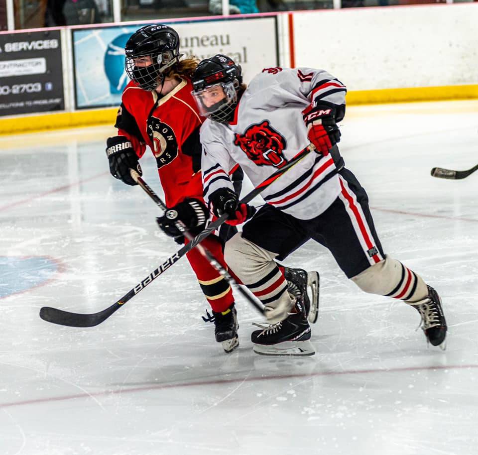 Courtesy photo / Steve Quinn
Juneau-Douglas High School: Yadaa.at Kalé Crimson Bears forward Zac Stagg, in white, will be one of three seniors to graduate this spring after a season of no games for the hockey team.