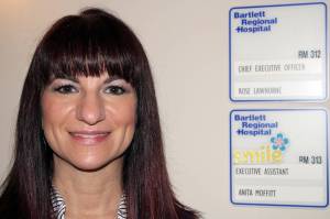 Rose Lawhorne, a longtime employee at Bartlett Regional Hospital, stands next to the new CEO nameplate outside her office on April 1. She takes over as CEO this week. Lawhorne first joined the hospital staff in 1993 and has worked her way up the ranks in a variety of roles. She expects to draw on her vast experience as she guides the hospital post-pandemic. (Dana Zigmund / Juneau Empire)