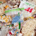 Prescriptions drugs, vitamins, hormones, and other drugs left in the drug drop box in the lobby of the Juneau Police Department displayed on Thursday, Sept. 26, 2019. The state is suing prescription drug companies, accusing them of helping to fuel a drug crisis in the state. (Michael Penn | Juneau Empire File)