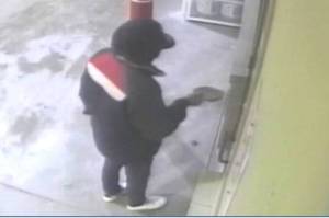 The Juneau Police Department are seeking a man, seen here in security footage, involved in the robbery of the Safeway fueling station early Sunday morning.