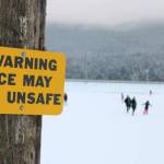 Many residents took to the ice at Twin Lakes as well as the parks snow-covered hills Friday, Nov. 20. (Ben Hohenstatt / Juneau Empire)