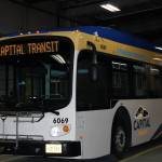 Juneau's first electric bus, parked in the Capital Transit garage on Thursday, April 8. 2021, will officially hit the streets next week. The bus took an inaugural spin on the city’s snowy streets as part of a ribbon-cutting ceremony for state and local officials, including Governor Mike Dunleavy, Juneau State Senator Jessie Kiehl and the Mayor of the City and Borough of Juneau, Beth Weldon. (Dana Zigmund / Juneau Empire)