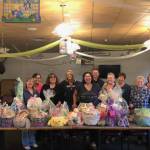 Women of the Moose volunteers pose with the Easter Baskets that they put together for all of the children at the AWARE shelter.  Each basket was made specific to each child’s age, said Jaime Isaak in an email. "A lot of happy children," Isaak said. (Courtesy Photo / Jaime Isaak)